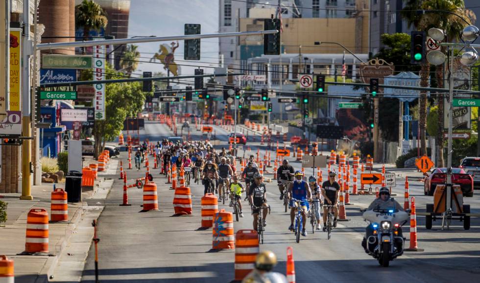 Participants in a Black Lives Matter bike ride against injustice ride down the Las Vegas Strip ...