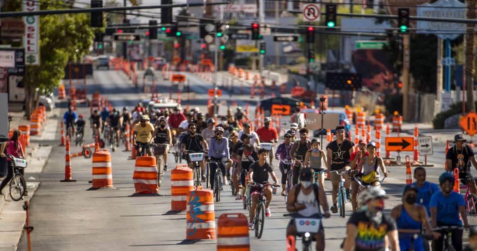 Participants in a Black Lives Matter bike ride against injustice ride down the Las Vegas Strip ...