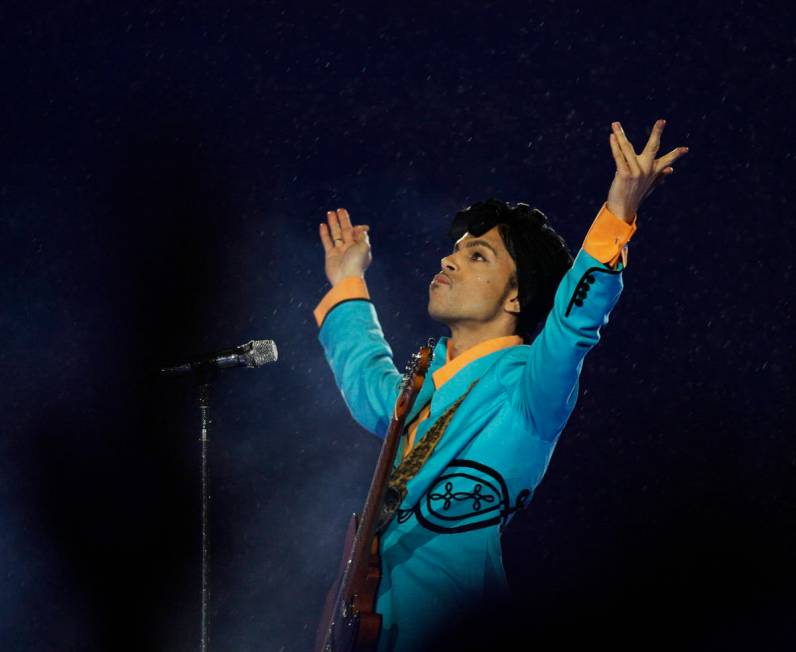 FILE- In this Feb. 4, 2007, file photo, Prince performs during the halftime show at Super Bowl ...