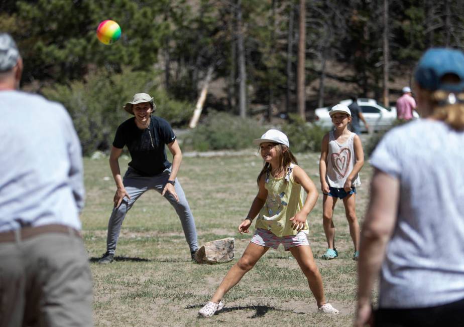 Eugene Deykhin, left, and his nieces Violetta Deykhin, center, and Tatiana Dekhin, right, play ...