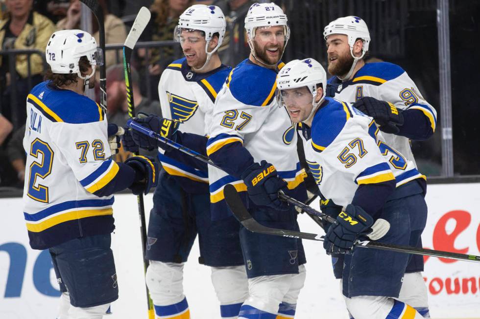 St. Louis Blues defenseman Justin Faulk (72), St. Louis Blues left wing Zach Sanford (12), St. ...