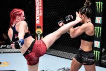 Gillian Robertson of Canada kicks Cortney Casey in their flyweight bout during the UFC Fight Ni ...