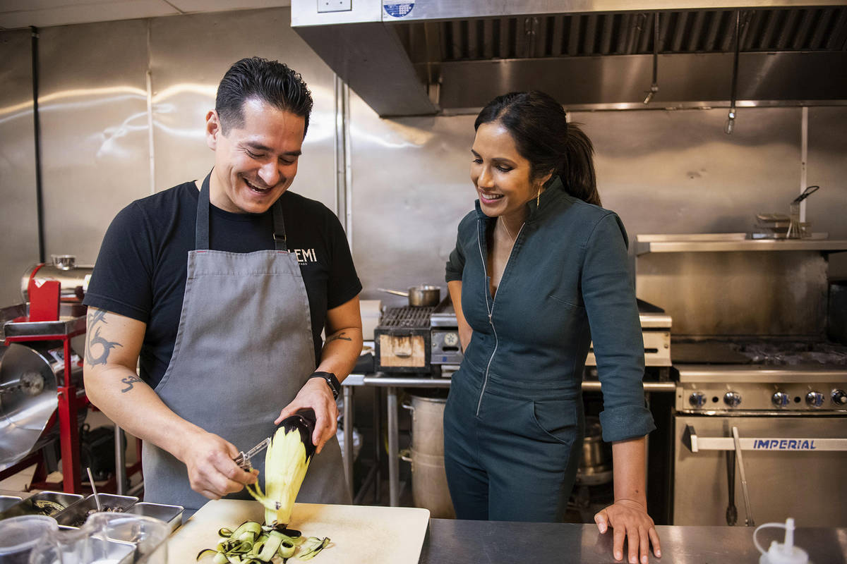 In this image released by Hulu, Emiliano Marentes, left, owner of Elemi, appears in his kitchen ...