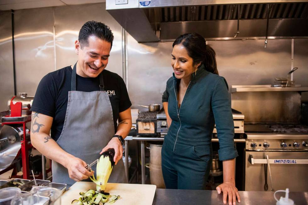 In this image released by Hulu, Emiliano Marentes, left, owner of Elemi, appears in his kitchen ...