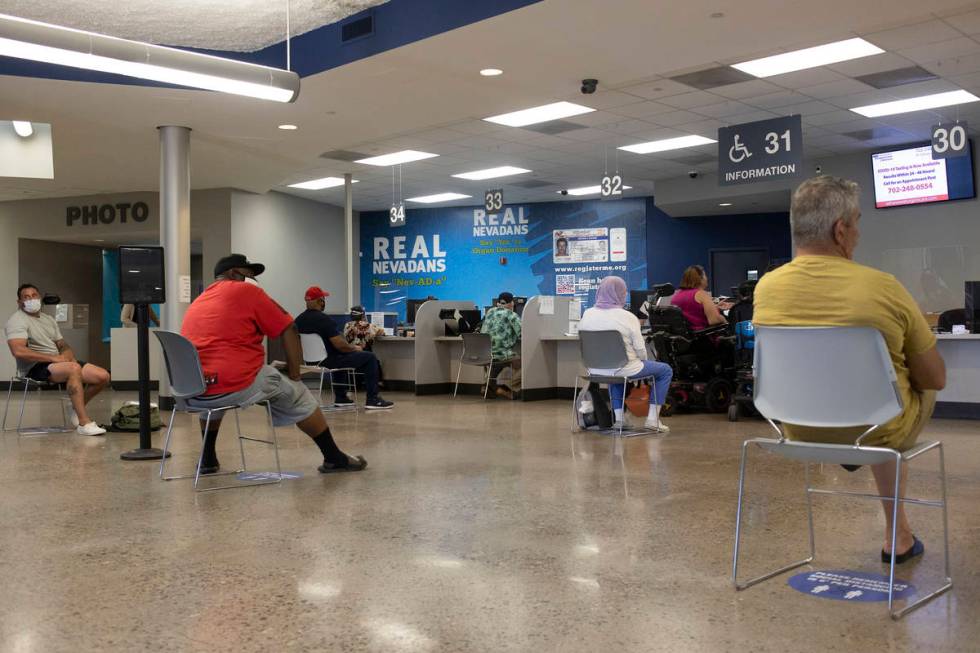 People near the finish line after long wait times at the Nevada Department of Motor Vehicles at ...