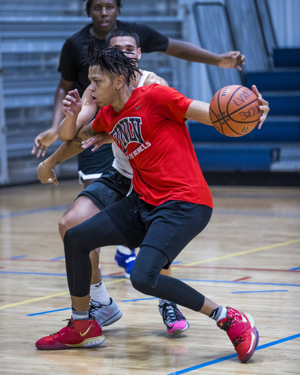 UNLV freshman wing Nick Blake drives the lane versus a defender on the court at the Tarkanian B ...
