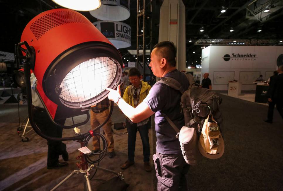 Filmmaker Paul Chou of Taiwan demonstrates Mole-Richardson's Vari-Tener 10k LED movie light dur ...