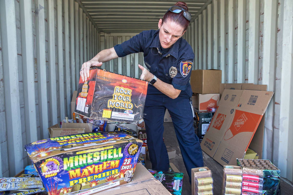 Amanda Wildermuth, with Clark County Fire Prevention, organizes confiscated illegal fireworks t ...