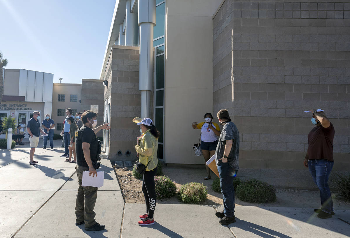 People wait in line at the Nevada Department of Motor Vehicles at 8250 West Flamingo Road, Las ...