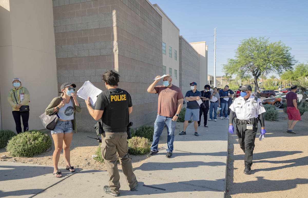 People wait in line at the Nevada Department of Motor Vehicles at 8250 West Flamingo Road, Las ...