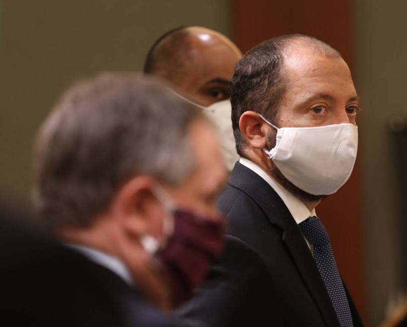 Prosecutor Christopher Hamner listens as defense attorney Tony Sgro speaks during a hearing for ...