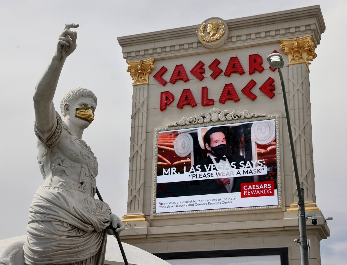 A statue of Julius Caesars dons a mask at Caesars on the Strip in Las Vegas Wednesday, June 24, ...