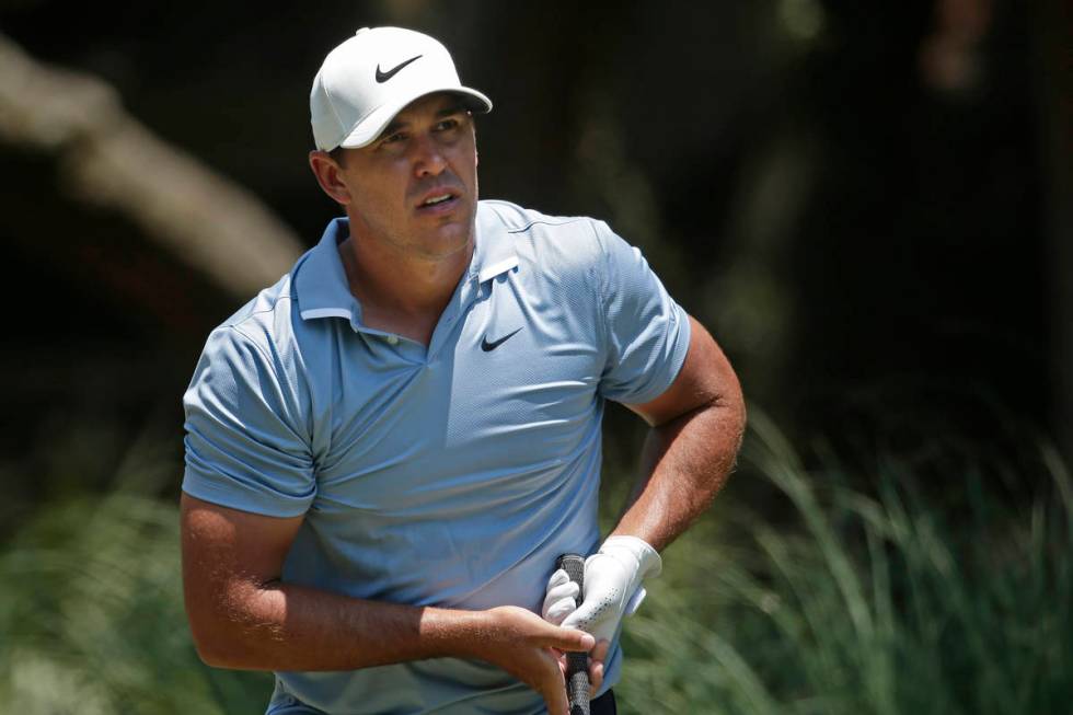 Brooks Koepka watches his shot off the second tee during the final round of the RBC Heritage go ...