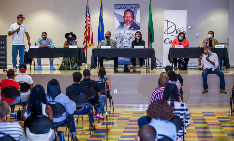 Rapper and entrepreneur Tip T.I. Harris as moderator, left, joins Clark County Commission Vice ...