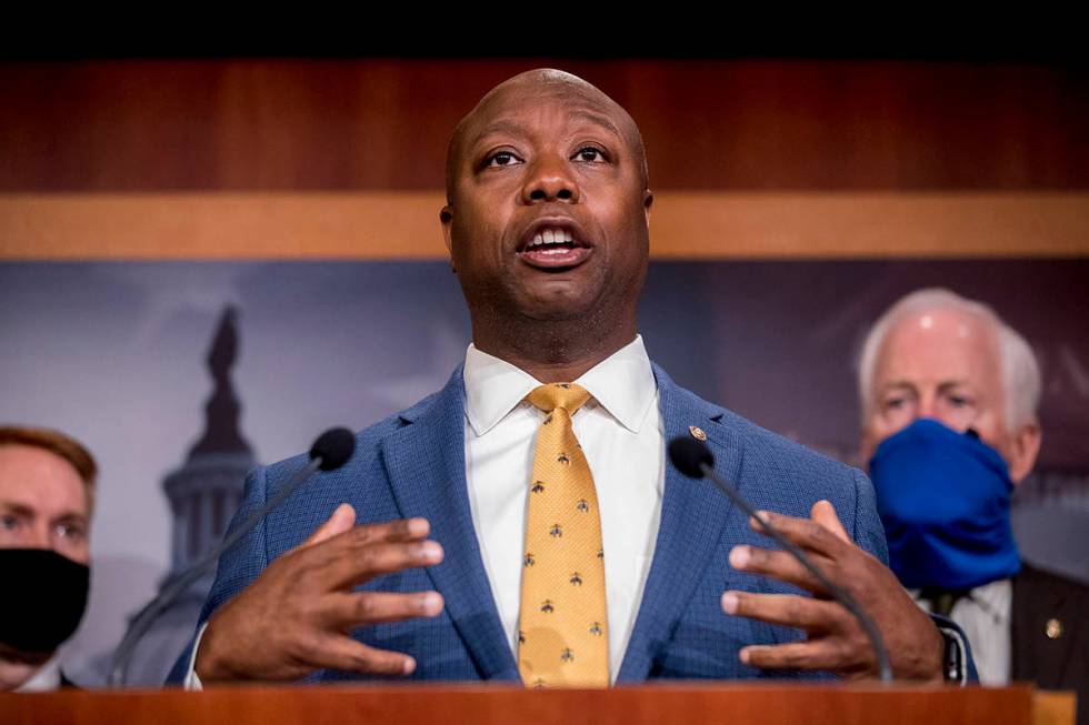 FILE - In this June 17, 2020, file photo, Sen. Tim Scott, R-S.C., accompanied by Republican sen ...