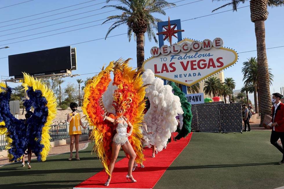 Showgirls walk the red carpet at the Welcome to Fabulous Las Vegas sign on the south Strip in L ...