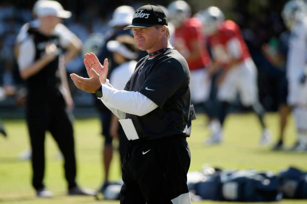 In this Aug. 8, 2019, file photo, Raiders head coach Jon Gruden claps during a combined NFL fo ...