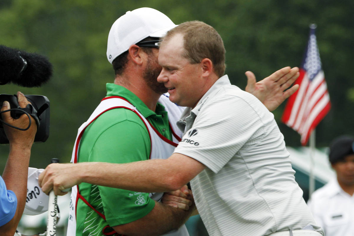 Ted Potter Jr. hugs his caddie as he celebrates winning the Greenbrier Classic PGA Golf tournam ...