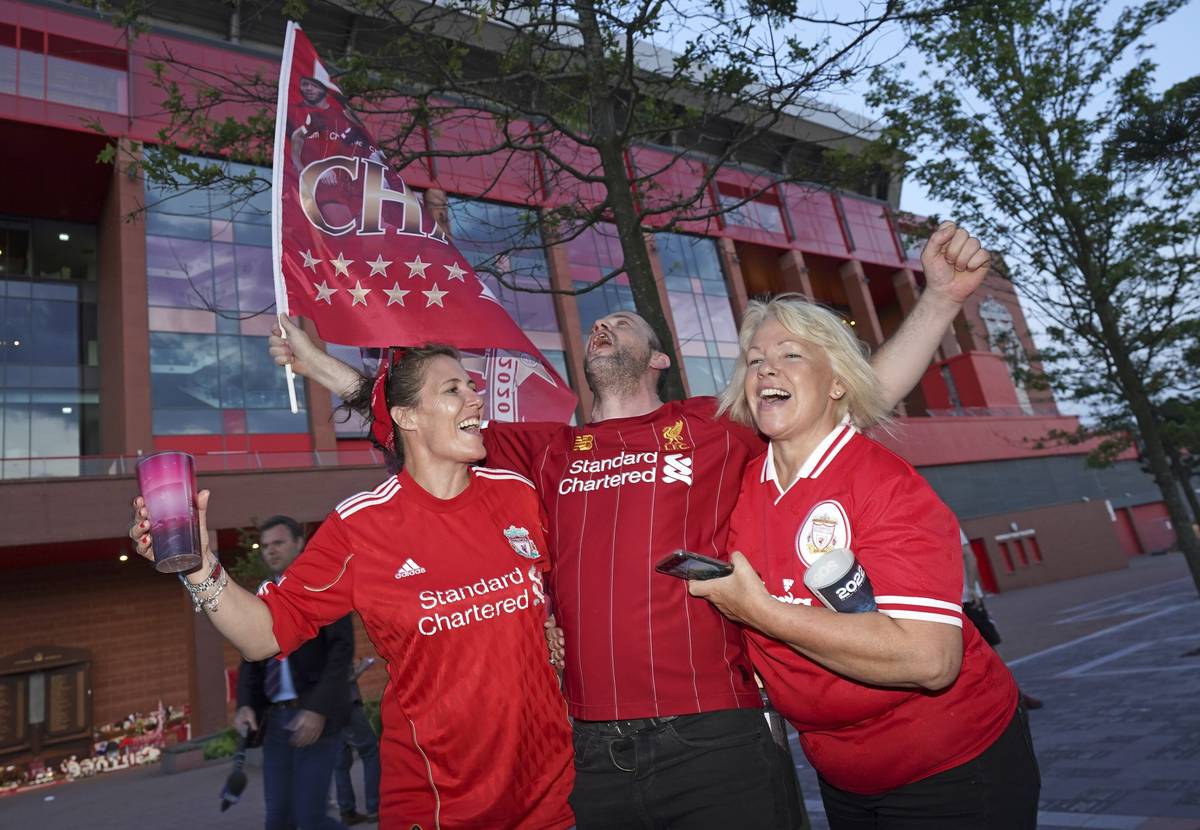 Liverpool supporters celebrates outside Anfield Stadium in Liverpool, England, Thursday, June 2 ...
