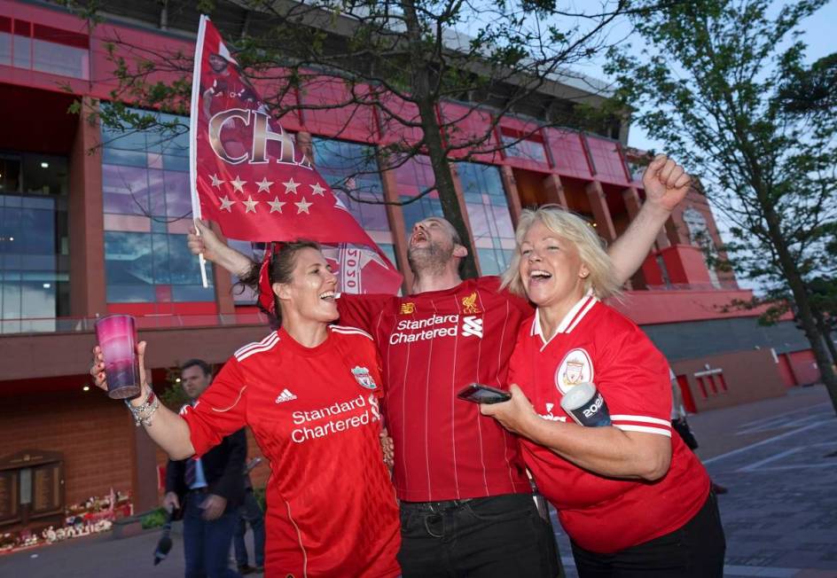 Liverpool supporters celebrates outside Anfield Stadium in Liverpool, England, Thursday, June 2 ...