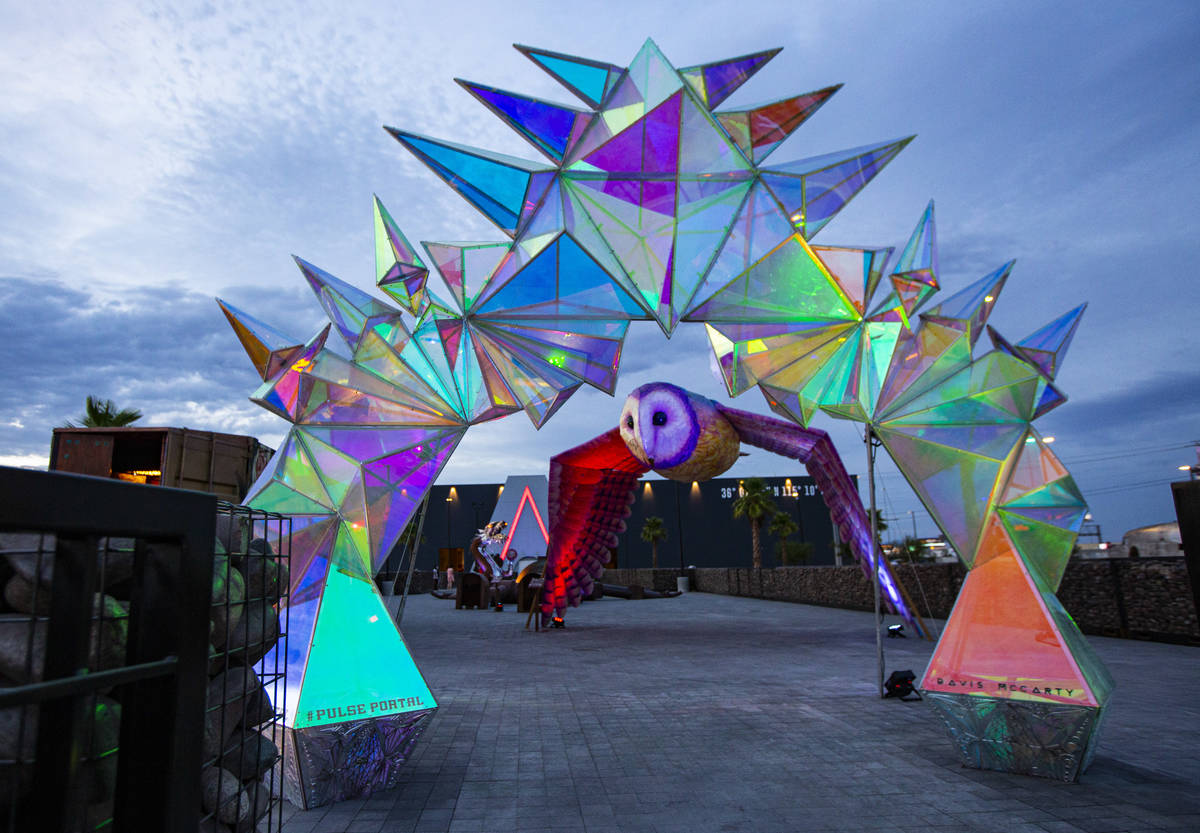 A view of sculptures "Pulse Portal" by Davis McCarty, in the foreground, and "OM ...