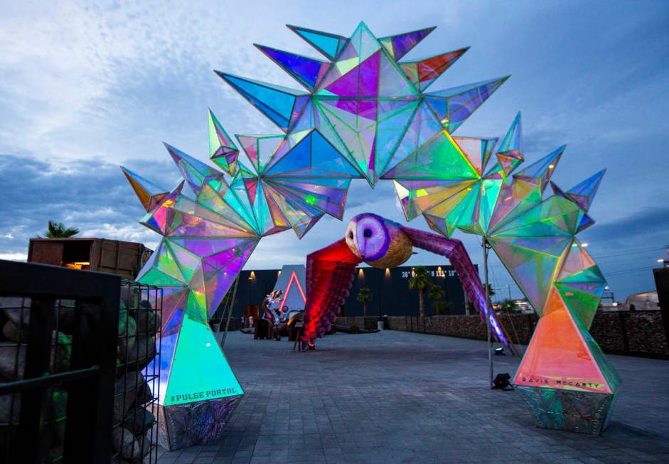 A view of sculptures "Pulse Portal" by Davis McCarty, in the foreground, and "OM ...