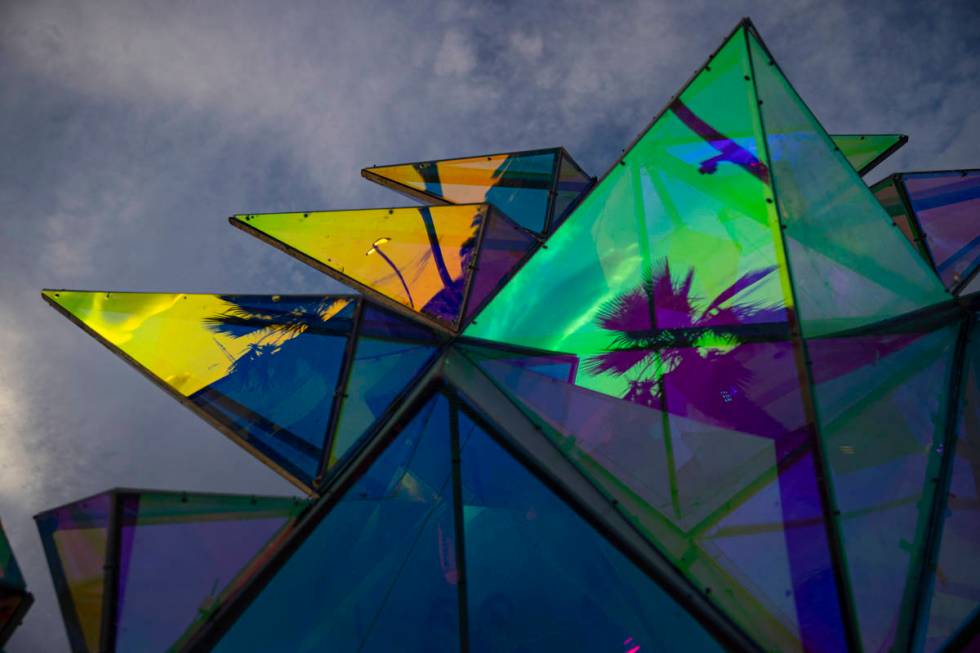 Reflections in the sculpture "Pulse Portal" by Davis McCarty at Area 15's Art Island ...