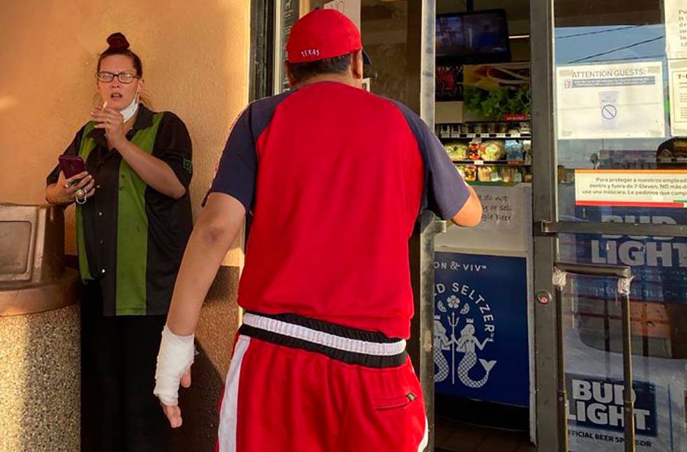 A clerk on a smoke break at a 7-Eleven store at Las Vegas Boulevard and Stewart Avenue tells an ...