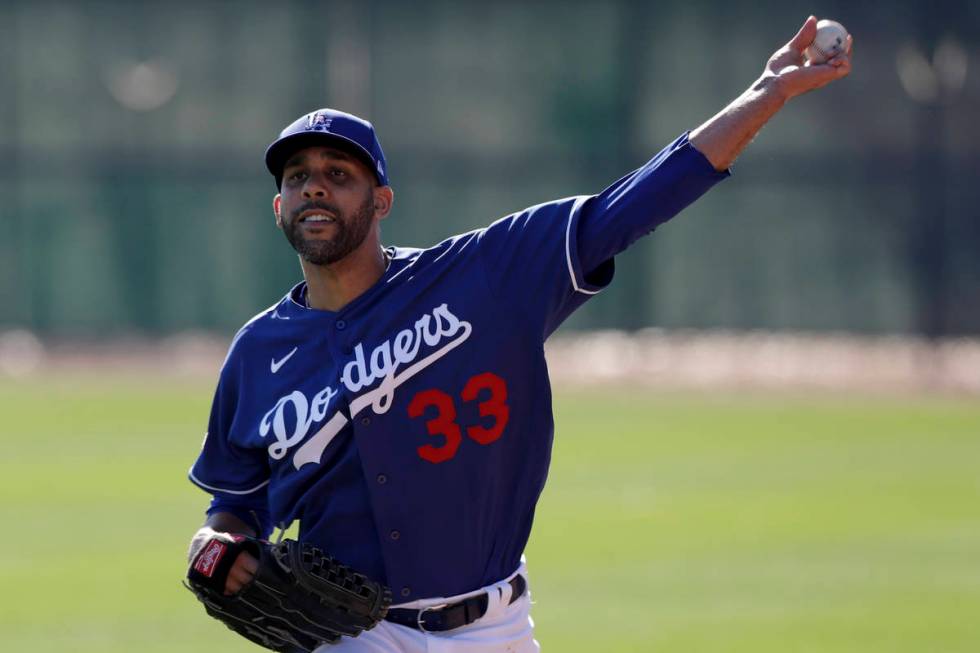 Los Angeles Dodgers pitcher David Price throws during spring training baseball Friday, Feb. 14, ...