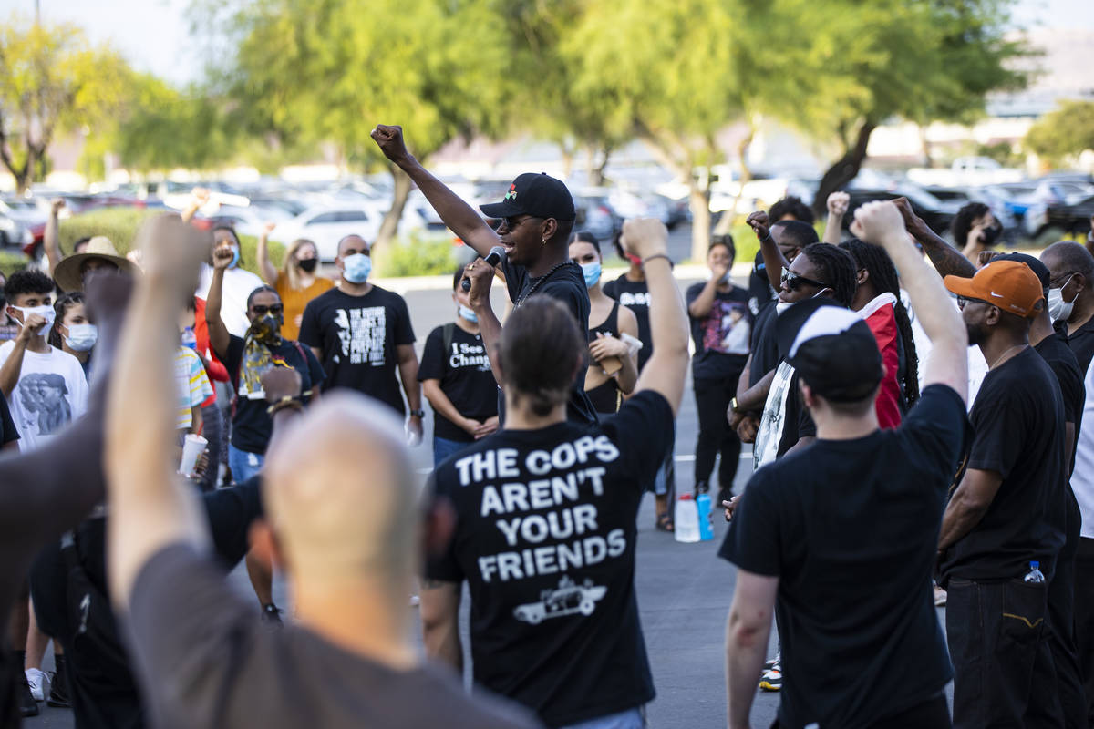 Minister Vance "Stretch" Sanders, center, speaks during a Black Lives Matter rally at the Sawye ...