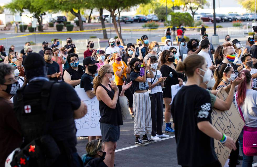 People cheer during a Black Lives Matter rally at the Sawyer Building in Las Vegas on Friday, J ...