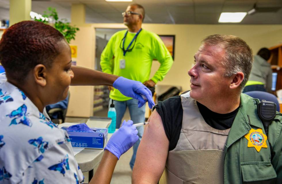 Tasheka Powell, Southern Nevada Health District registered nurse, gives Metropolitan Police Dep ...