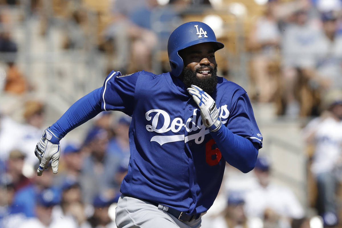 Los Angeles Dodgers' Andrew Toles runs to first during the second nning of a spring training ba ...