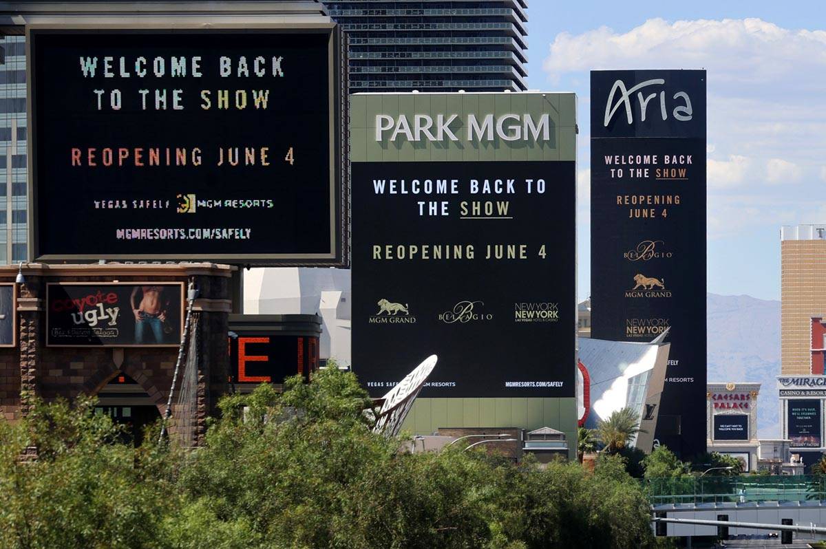 Marquees for MGM Resorts International properties on the Strip in Las Vegas, including from lef ...