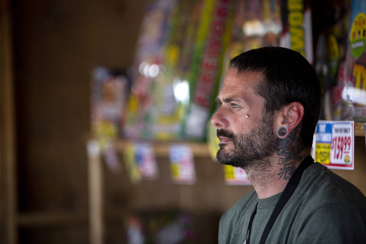 Jeremiah Wicker sits inside the fireworks booth for Freedom House Sober Living in Las Vegas on ...