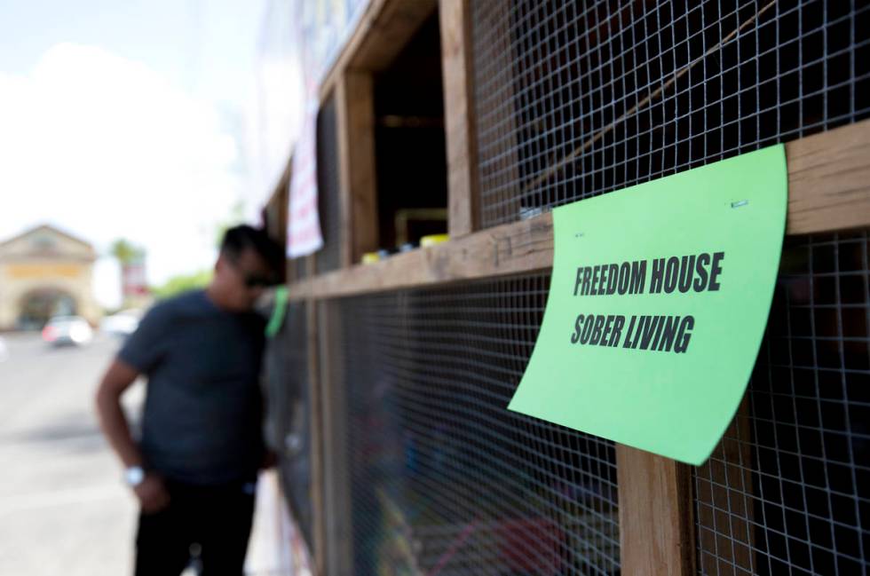 Floyd Ellis looks at the deals for fireworks on the front of the booth for Freedom House Sober ...