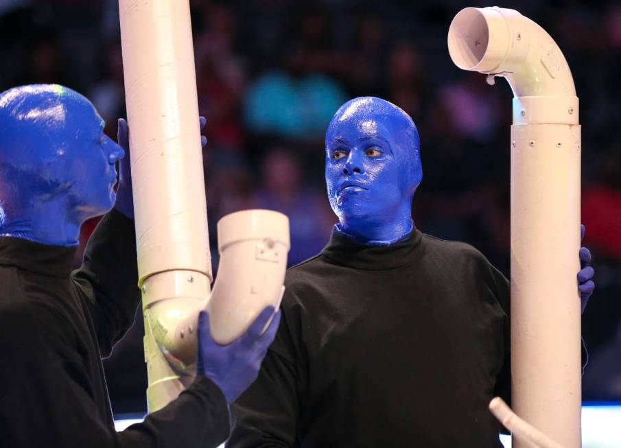 Blue Man Group take part in a half time performance at center-court during the Las Vegas Aces a ...