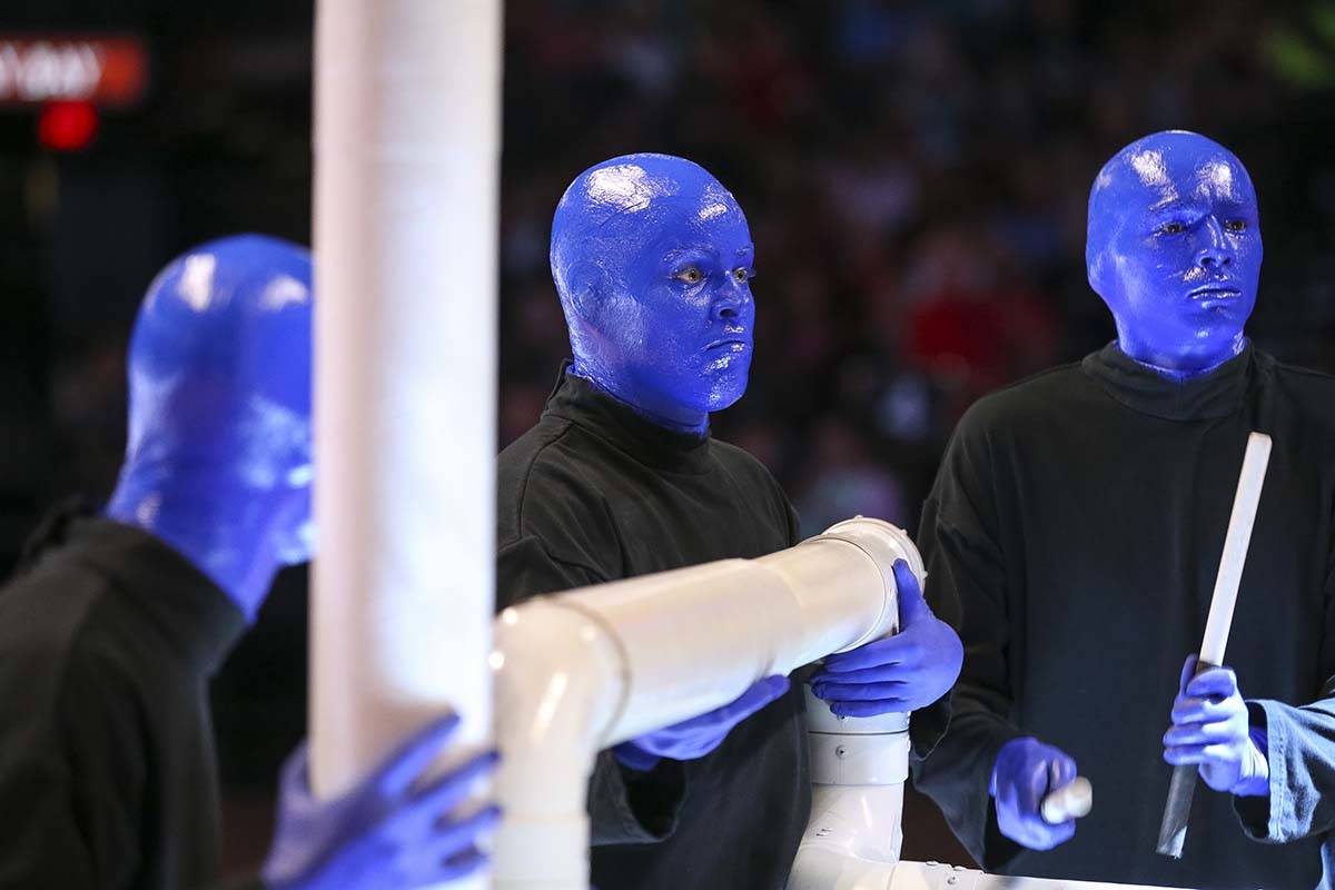 Blue Man Group take part in a half time performance at center-court during the Las Vegas Aces a ...