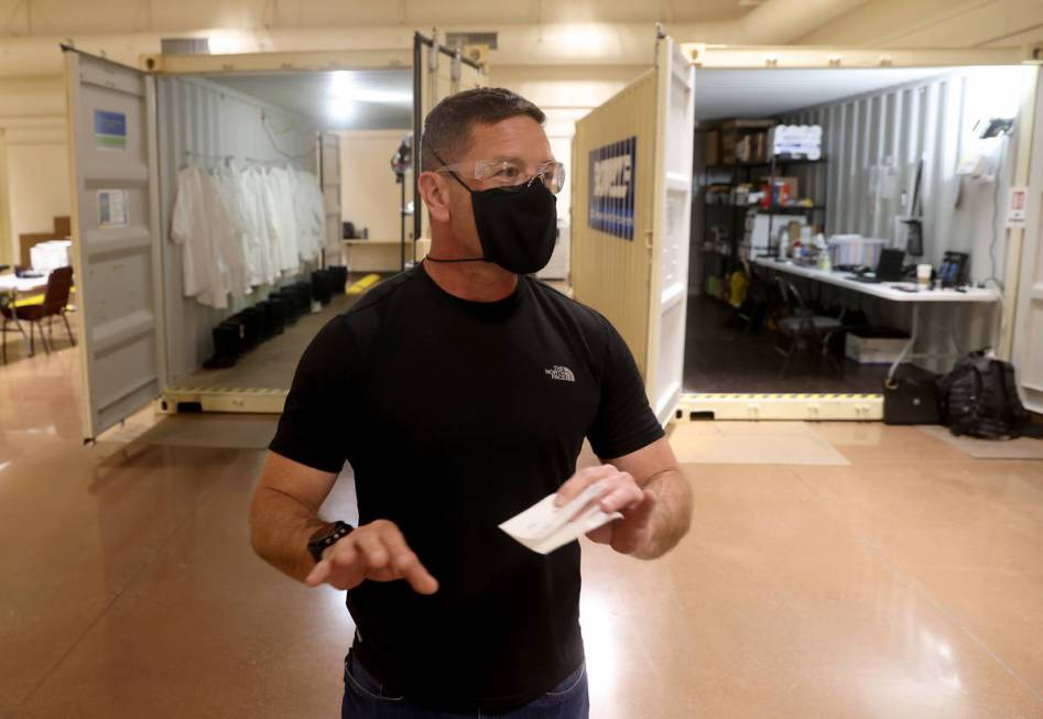 Site lead Abe Morrison talks to a reporter at the Battelle Critical Care Decontamination System ...