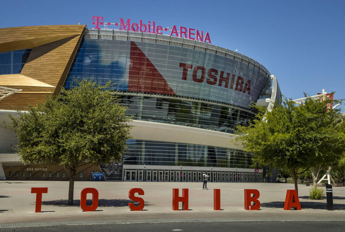 A pedestrian walks in front of the T-Mobile Arena a block off the Las Vegas Strip on Friday, Ma ...