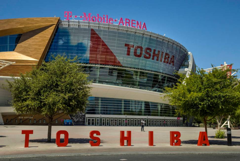 A pedestrian walks in front of the T-Mobile Arena a block off the Las Vegas Strip on Friday, Ma ...