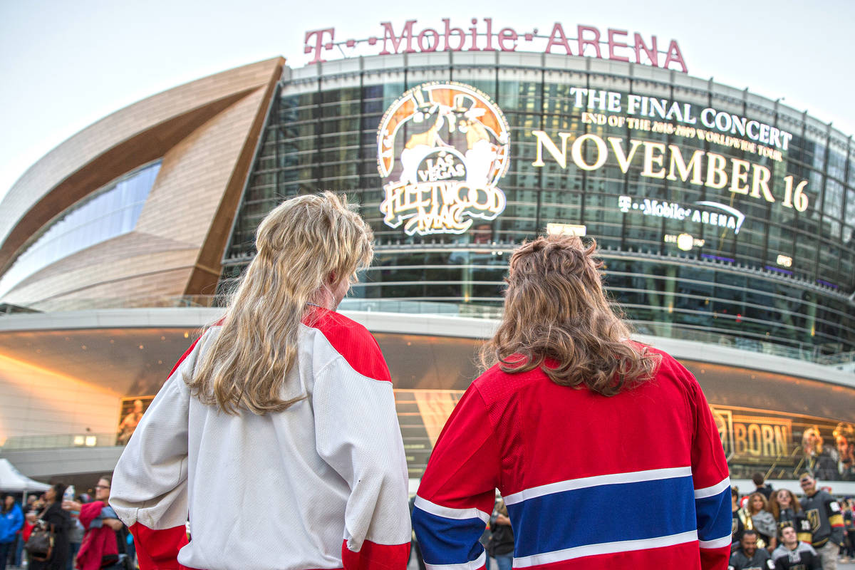 David Mayhew, right, and Michael Campbell in their Halloween outfits outside T-Mobile Arena bef ...