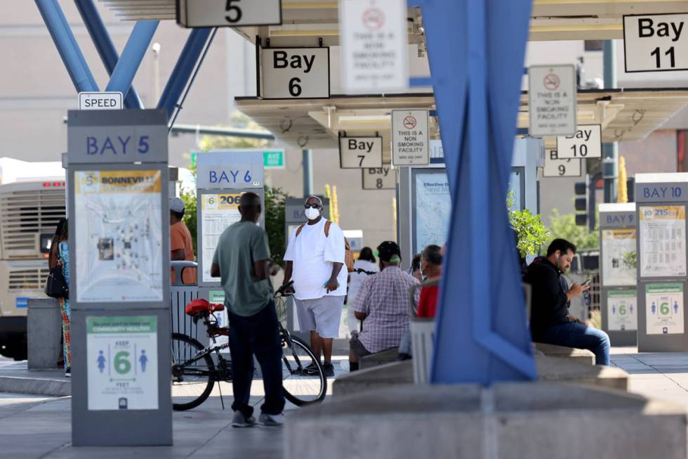 People wait for buses at Regional Transportation Commission Bonneville Transit Center in downto ...