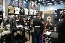 Former Raiders wide receiver Cliff Branch and linebacker Jerry Robinson greeted and signed aut ...