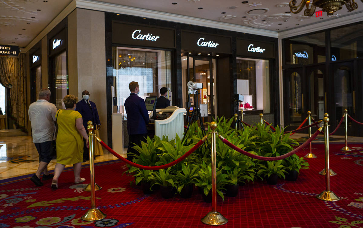 Security guards monitor thermal scanners at the Wynn Las Vegas in Las Vegas on Saturday, June 2 ...