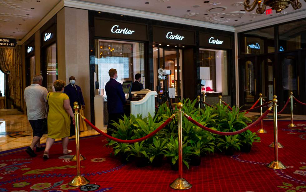 Security guards monitor thermal scanners at the Wynn Las Vegas in Las Vegas on Saturday, June 2 ...