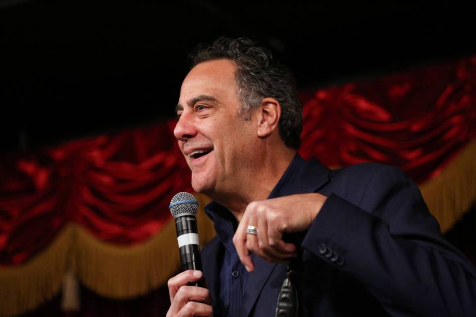 Comedian Brad Garrett, left, officiates the wedding of Cyndi Nelson and comedian Rob Sherwood ...