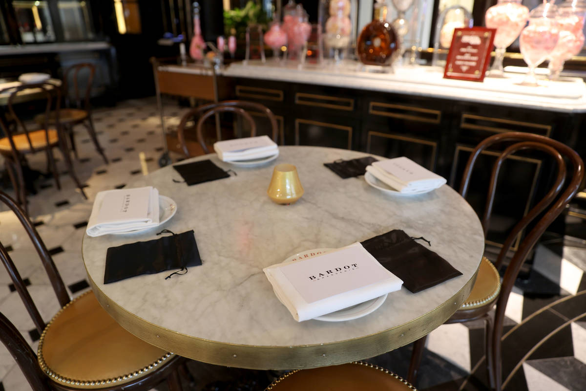 Bardot Brasserie table settings come with a mask bag at Aria on the Strip in Las Vegas upon reo ...