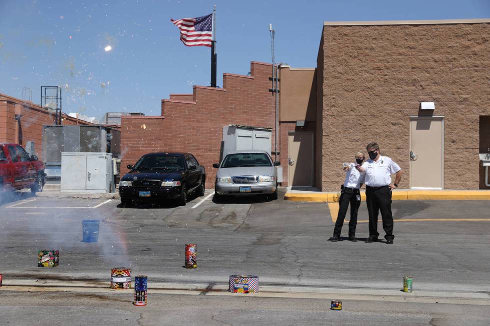 Las Vegas Fire and Rescue's fire inspectors Melanie Dennon, left, and Scott Thompson, give a de ...