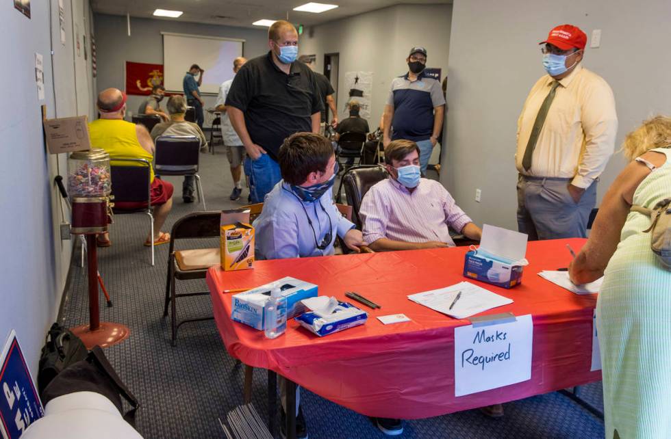 Volunteers arrive to receive in-person training at President Donald Trump's re-election campaig ...